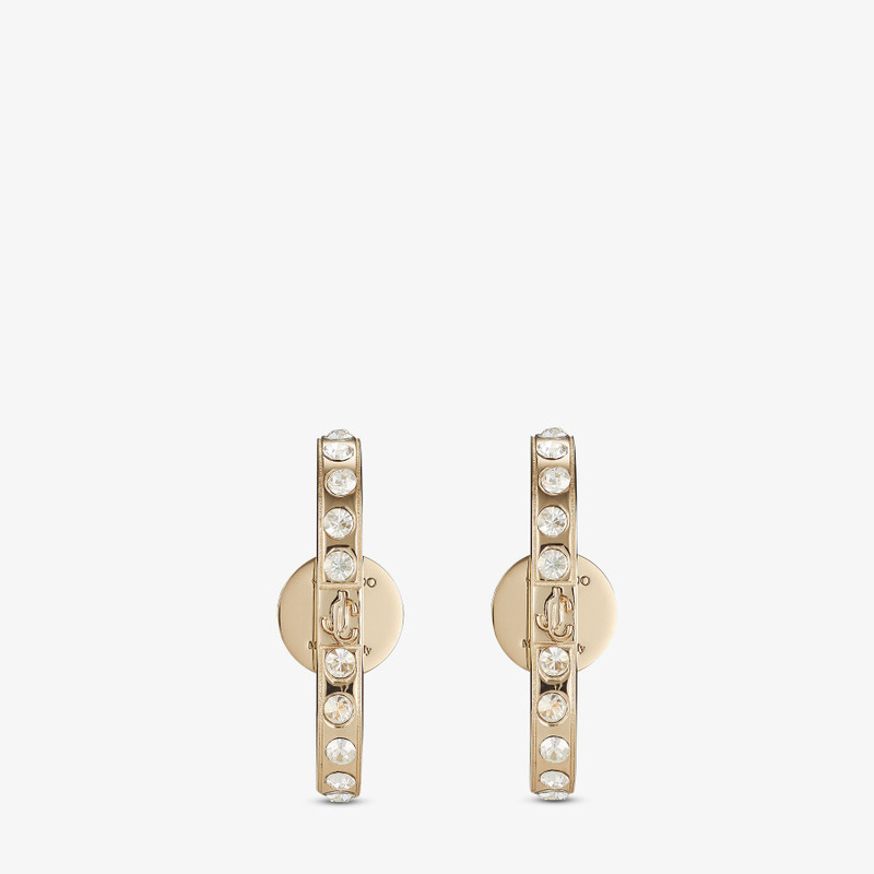 JC Cuff Earring
Gold-finish Metal and Crystal Cuff Earrings with JC Monogram 1
