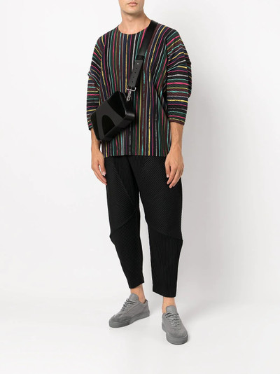 ISSEY MIYAKE tapered-leg plissé trousers outlook