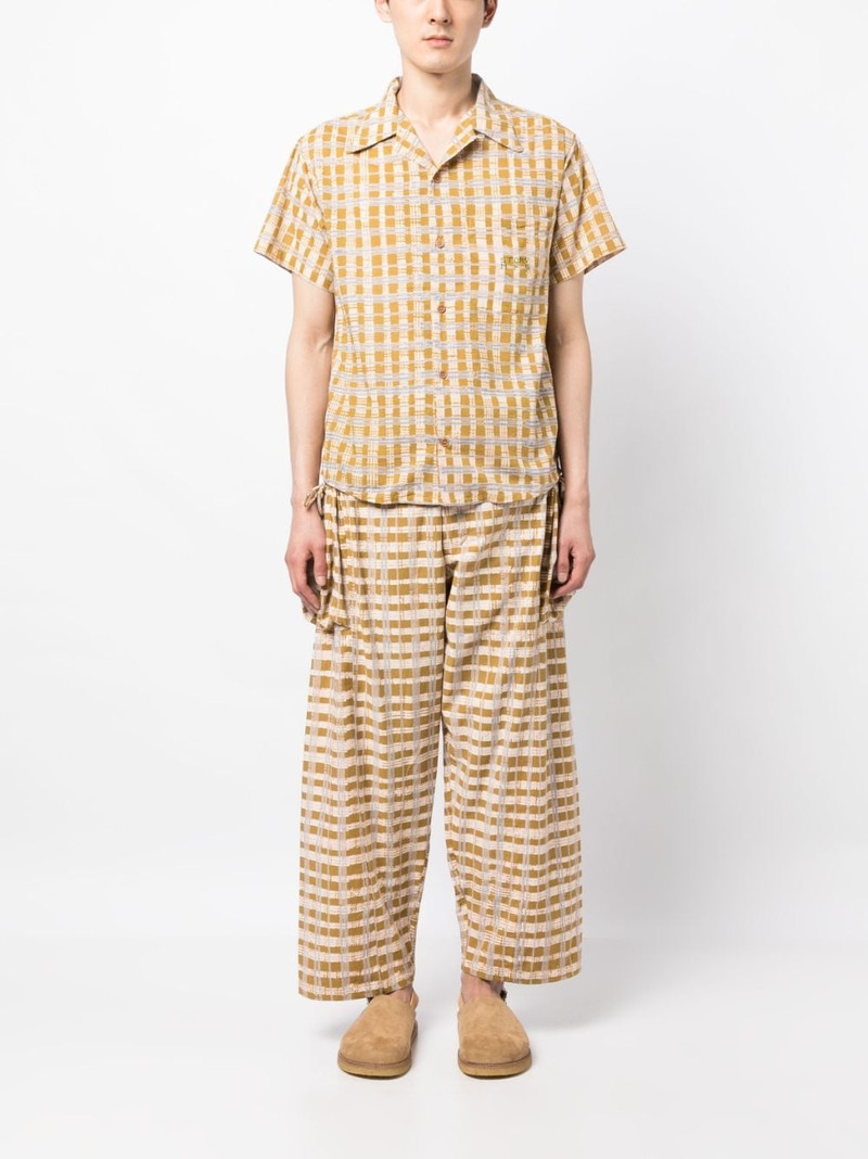Story mfg. check-print wide-leg trousers outlook