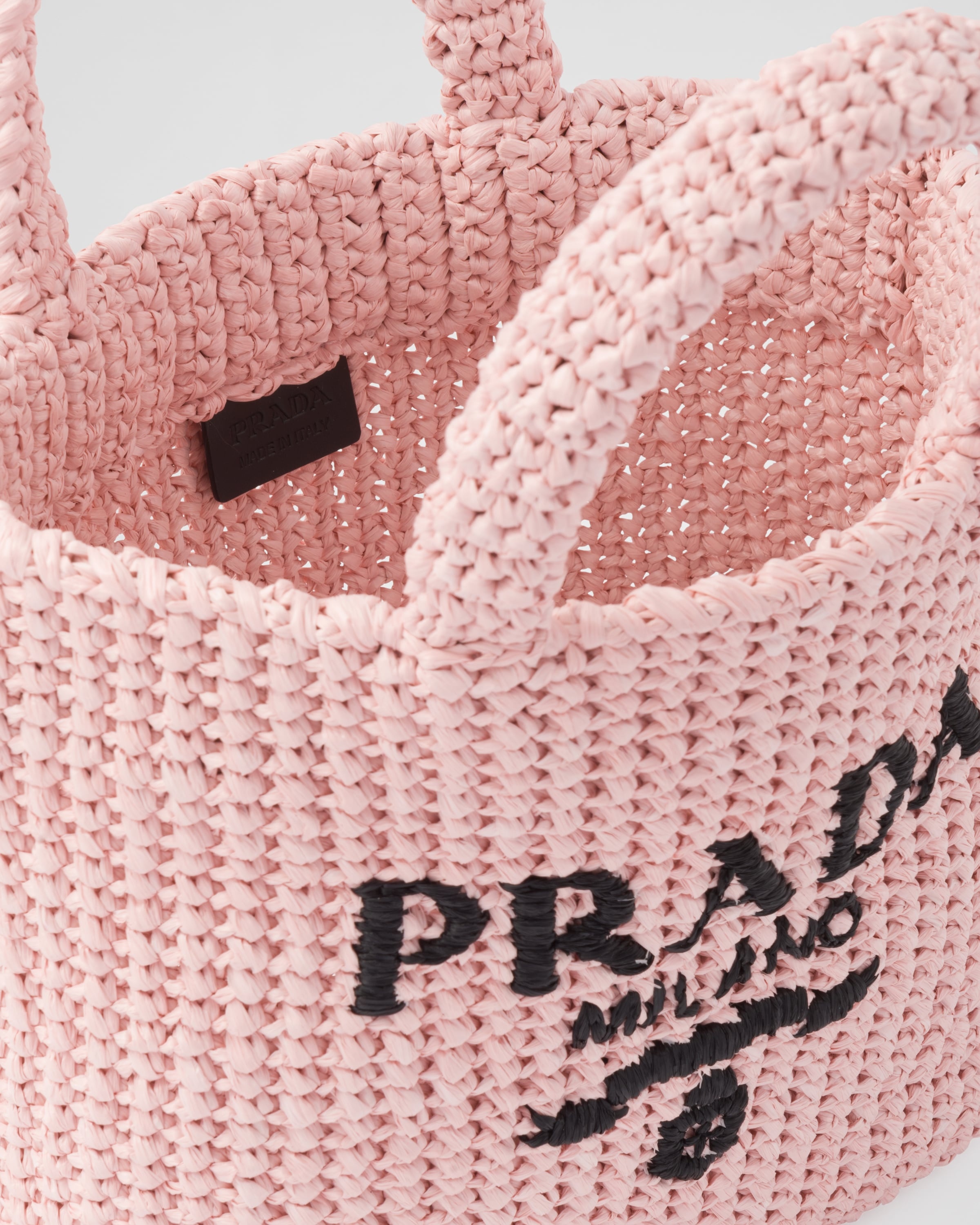 Prada triangle-logo raffia mini bag - Pink