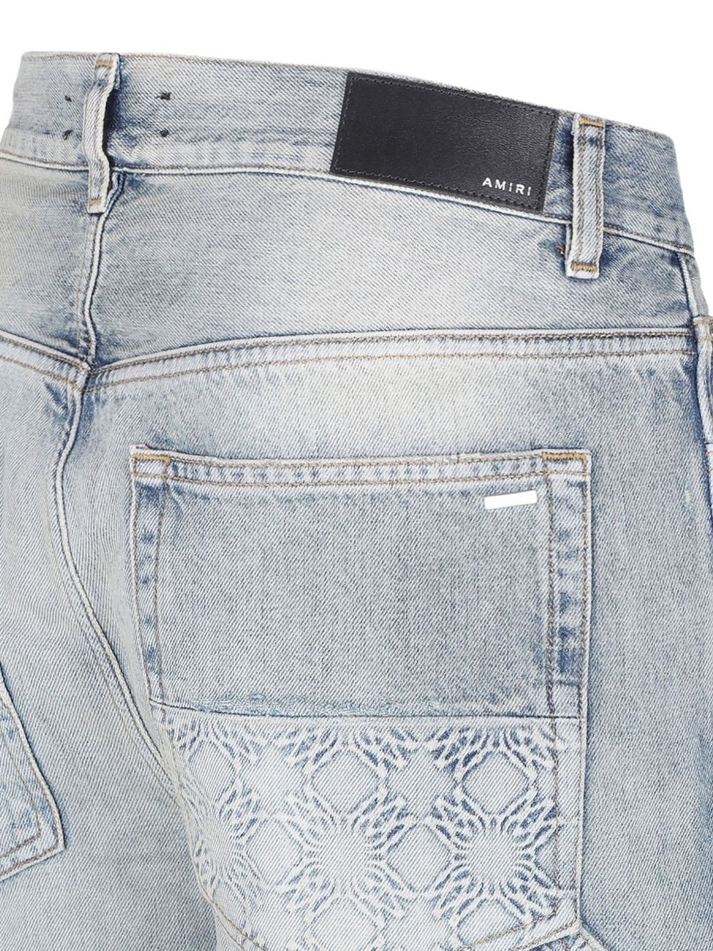 monogram-debossed jeans - 4
