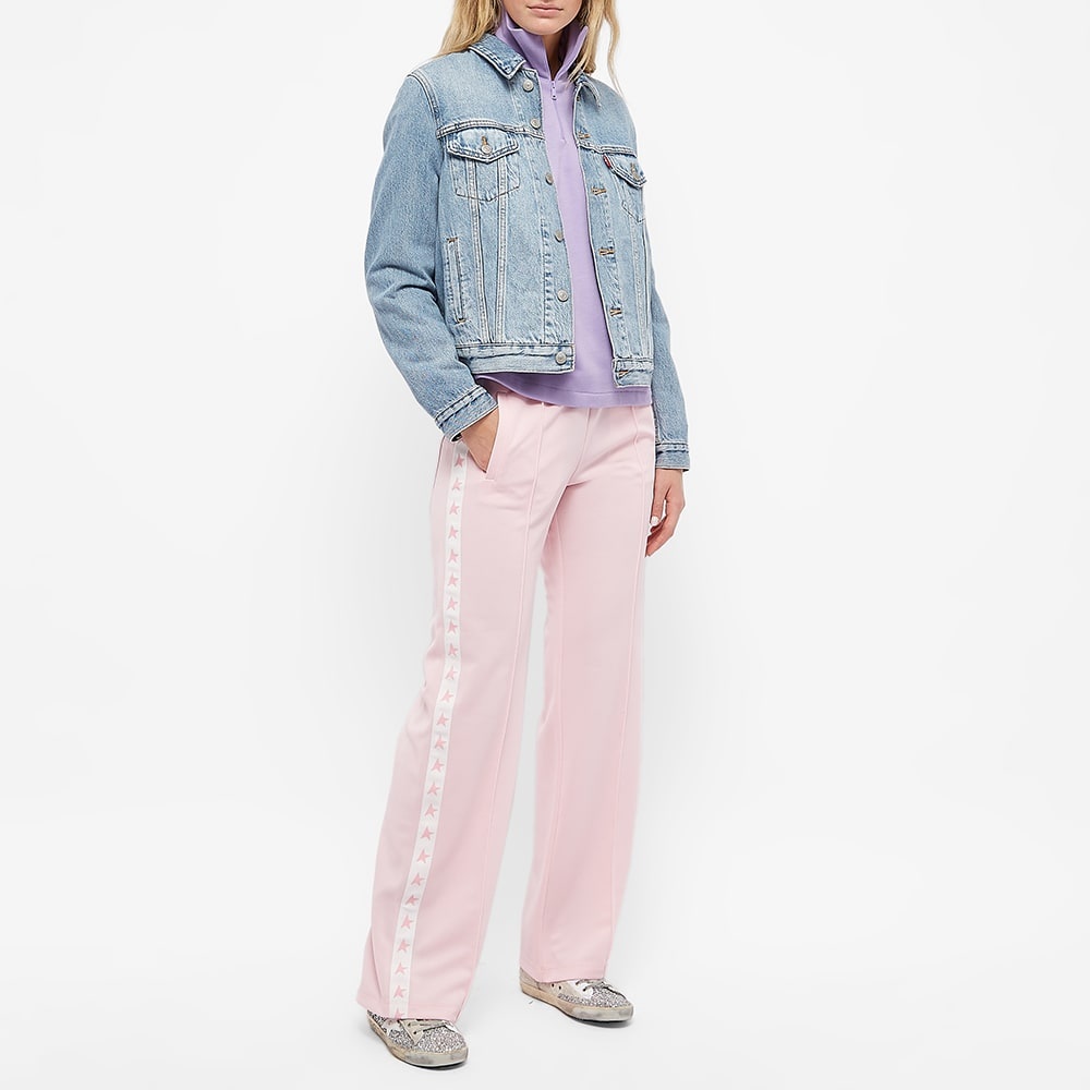 Women's pink joggers with band and stars on the sides