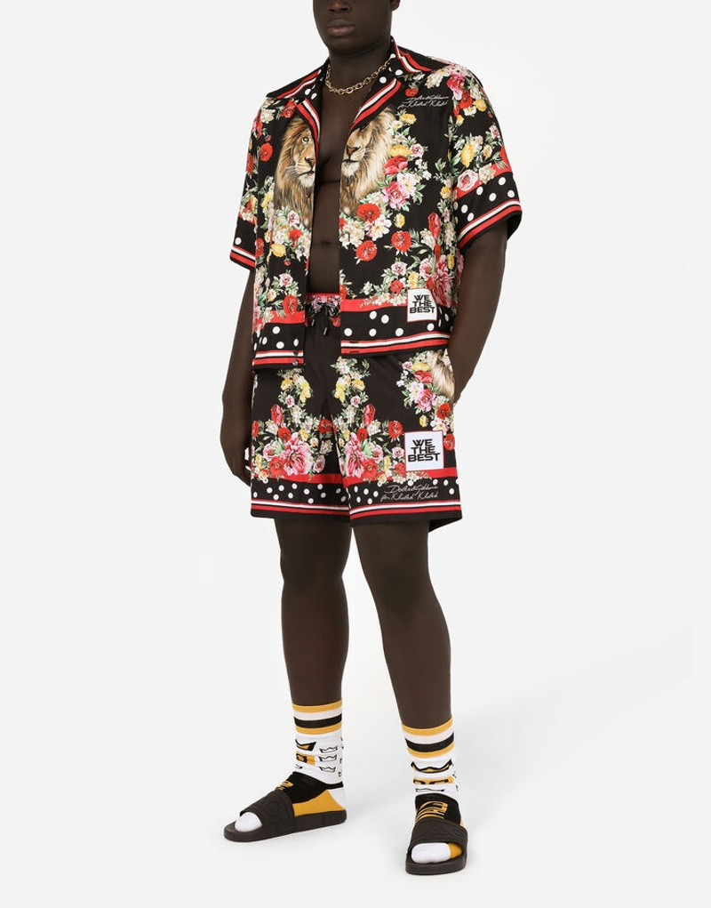 Dolce & Gabbana Mid-length swim trunks with lion mix print outlook