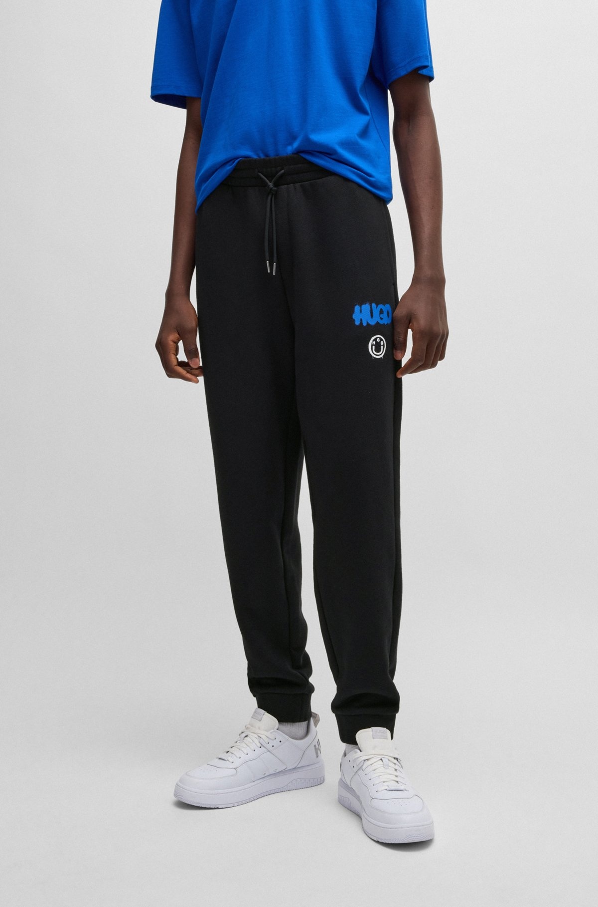 COTTON-TERRY TRACKSUIT BOTTOMS WITH HAPPY HUGO LOGO - 2