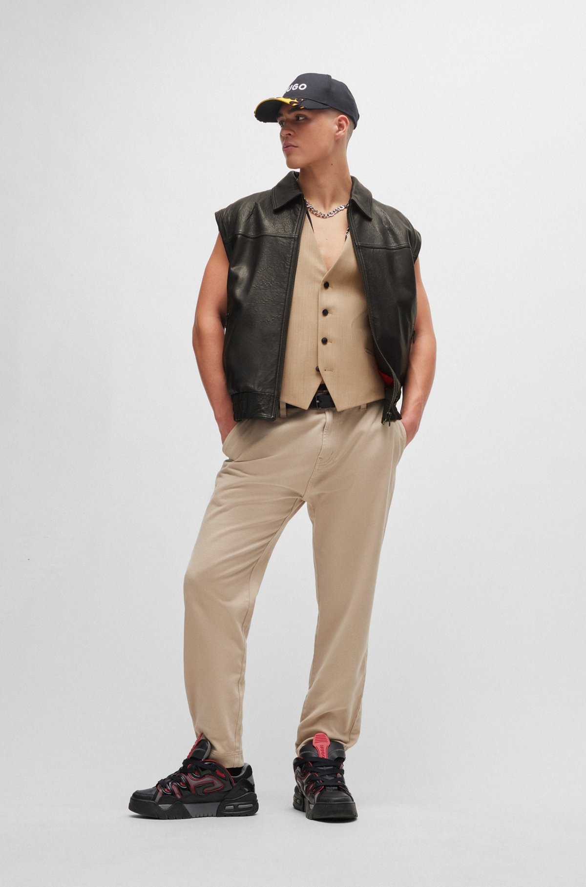 LEATHER JACKET WITH DETACHABLE SLEEVES AND STUD ARTWORK - 3