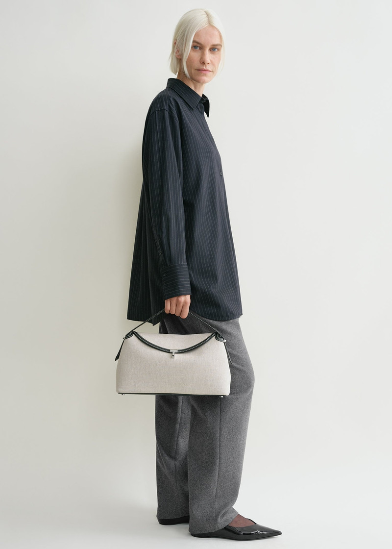 Totême T-Lock top handle ecru/black outlook