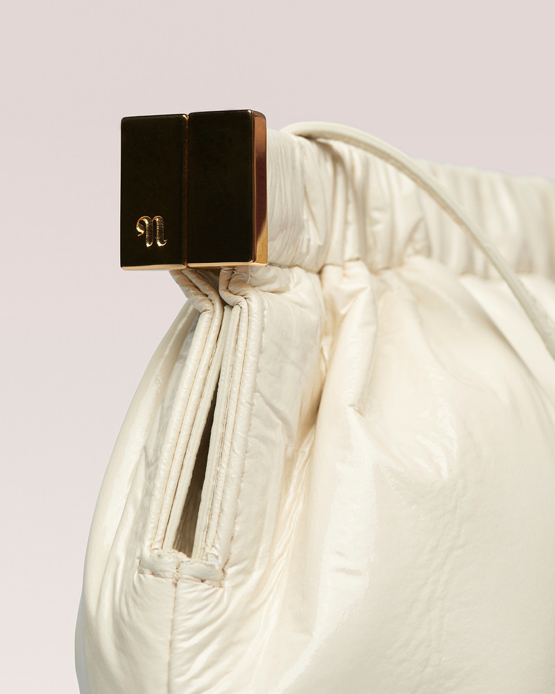 Nanushka THE BAR CLUTCH MINI - Soft patent mini clutch - Creme outlook