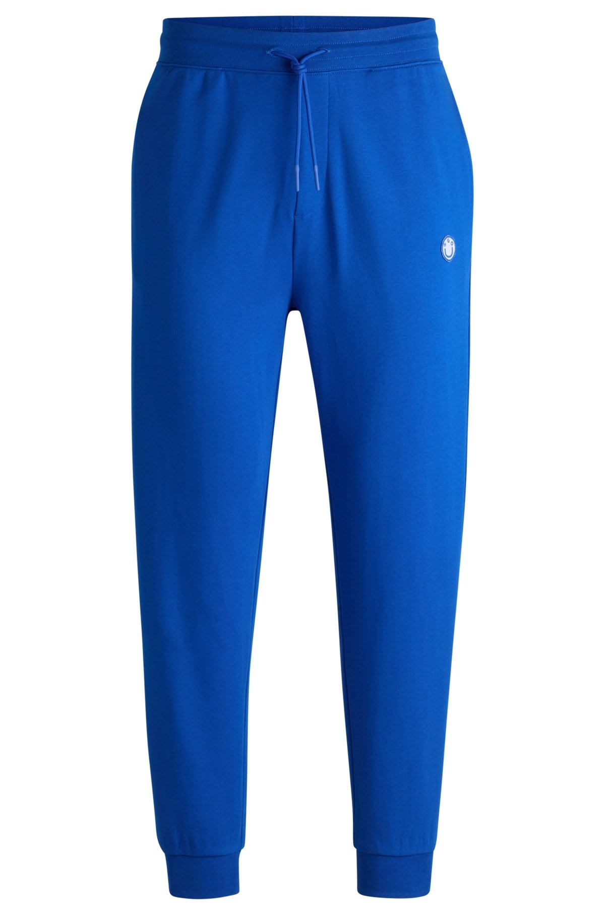 COTTON-TERRY TRACKSUIT BOTTOMS WITH HAPPY HUGO LOGO PATCH - 1