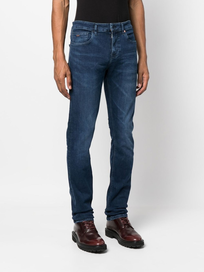 mid-wash logo-patch jeans 3