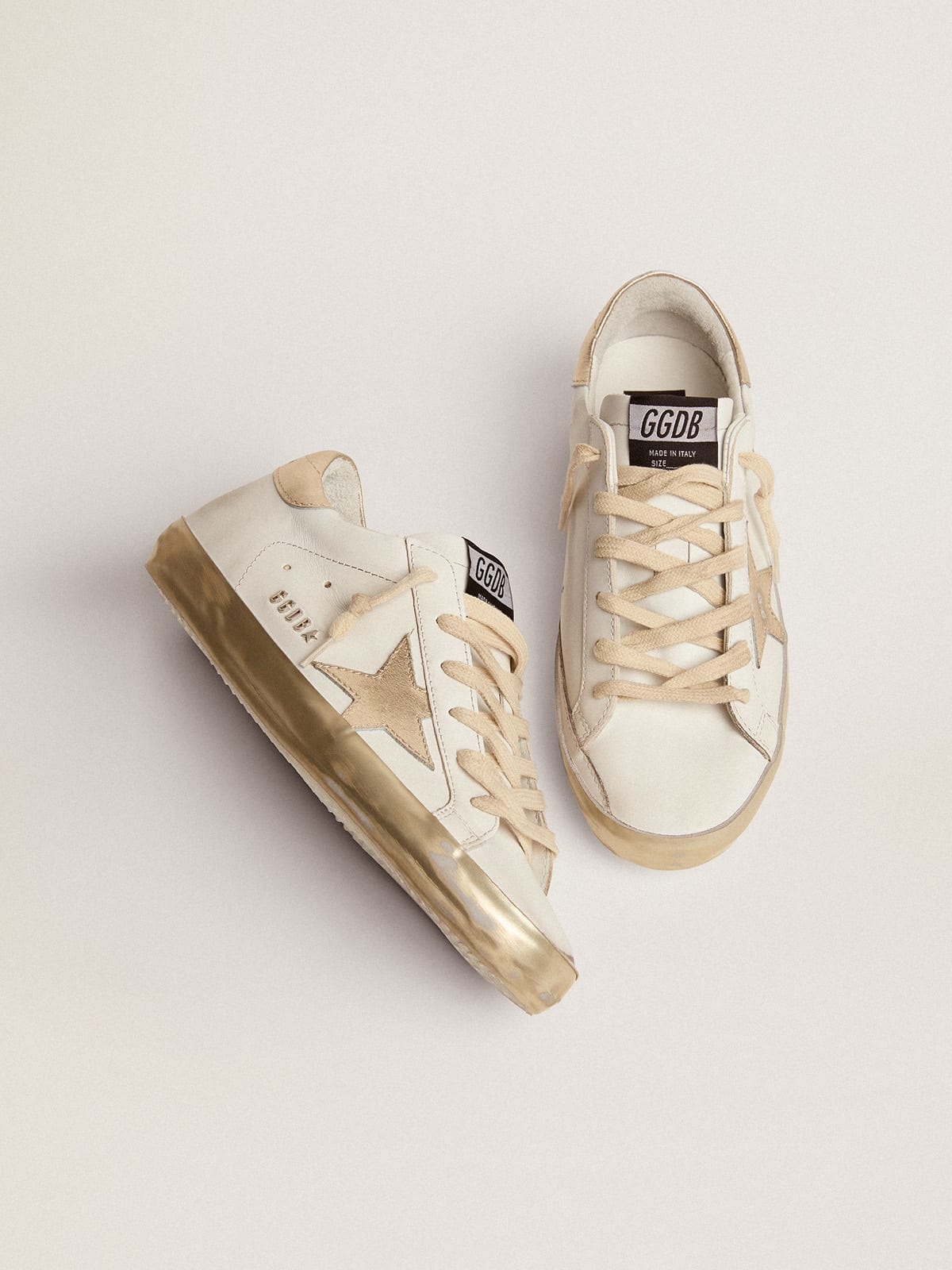 Women’s Super-Star sneakers with gold sparkle foxing and metal stud  lettering