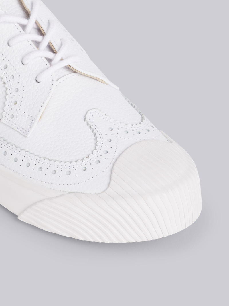 Thom Browne White Pebbled Calfskin Longwing Brogue Trainer outlook