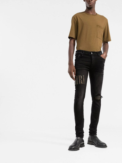 AMIRI distressed skinny jeans outlook