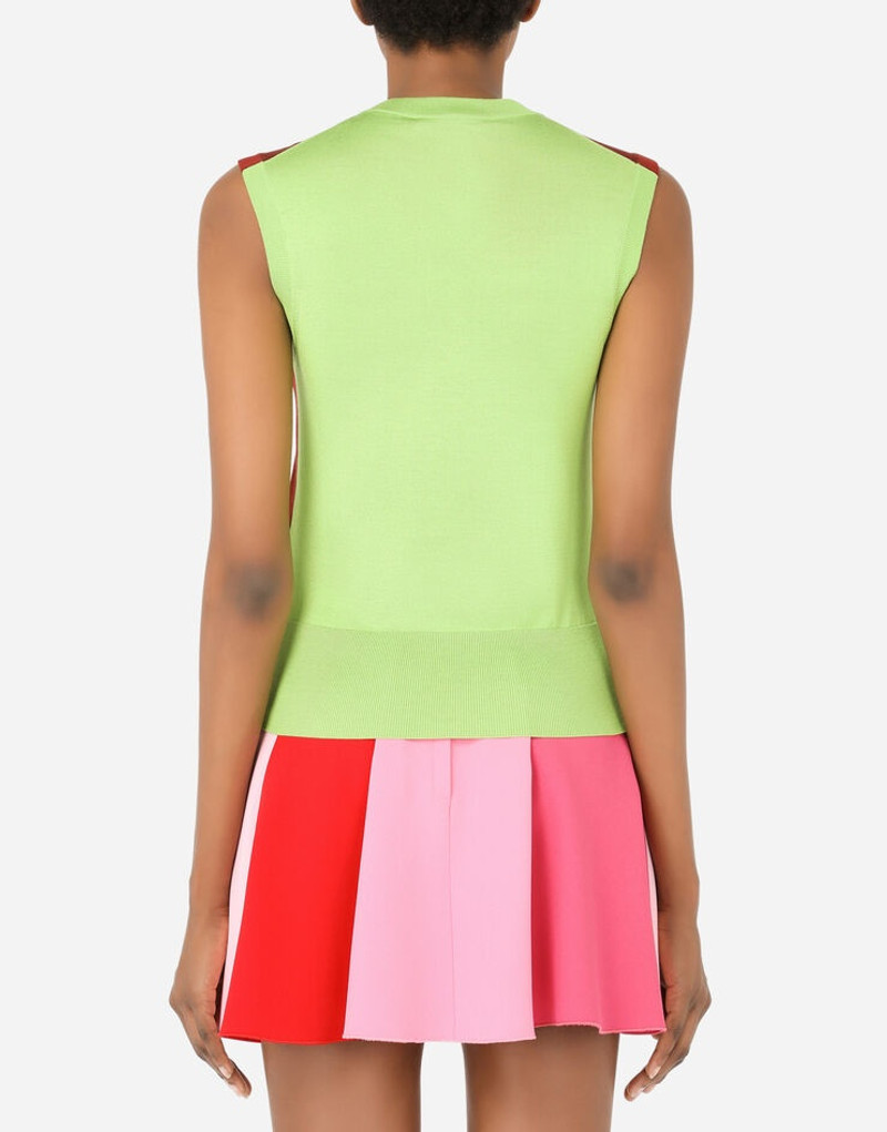 Dolce & Gabbana Sleeveless multi-colored silk sweater with patent leather DG patch outlook