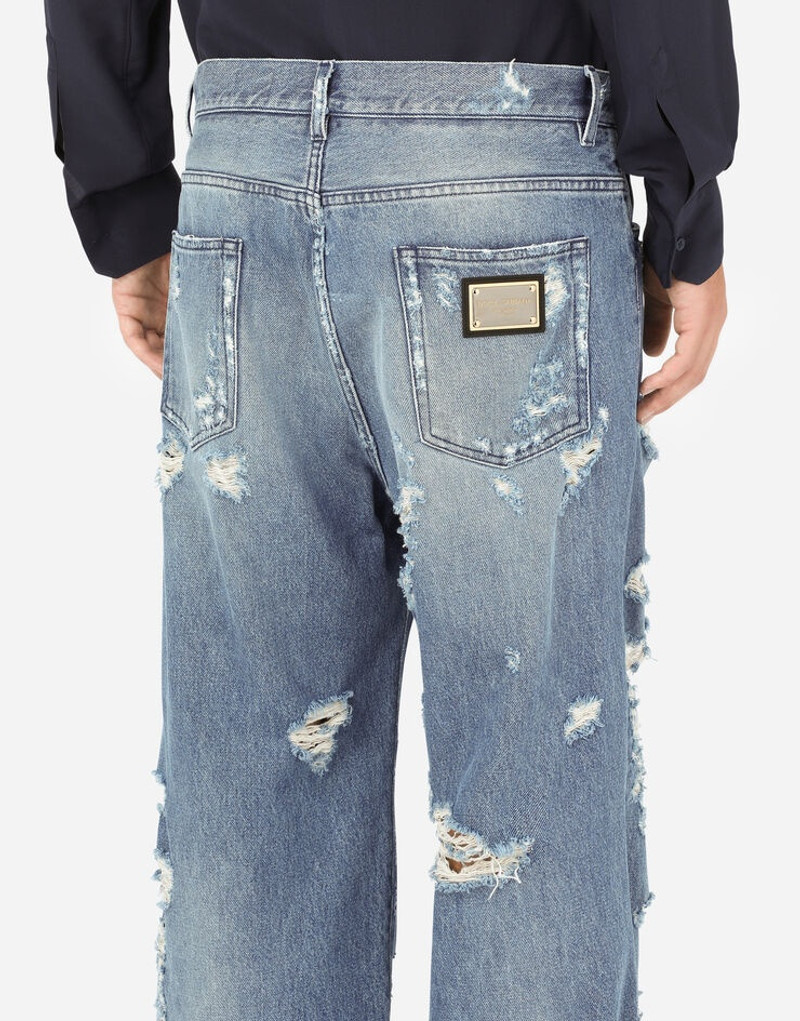 Oversize light blue wash jeans with rips 5