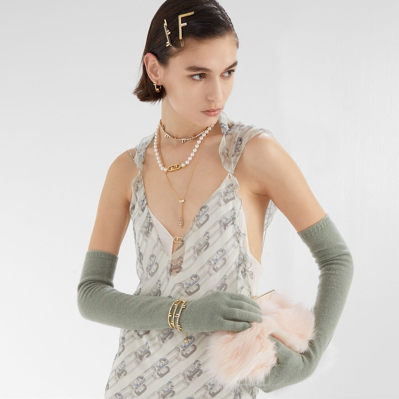 Hair clip with Fendi First logo. Made of gold-finish metal. Decorated with Baguette-cut white crysta 3