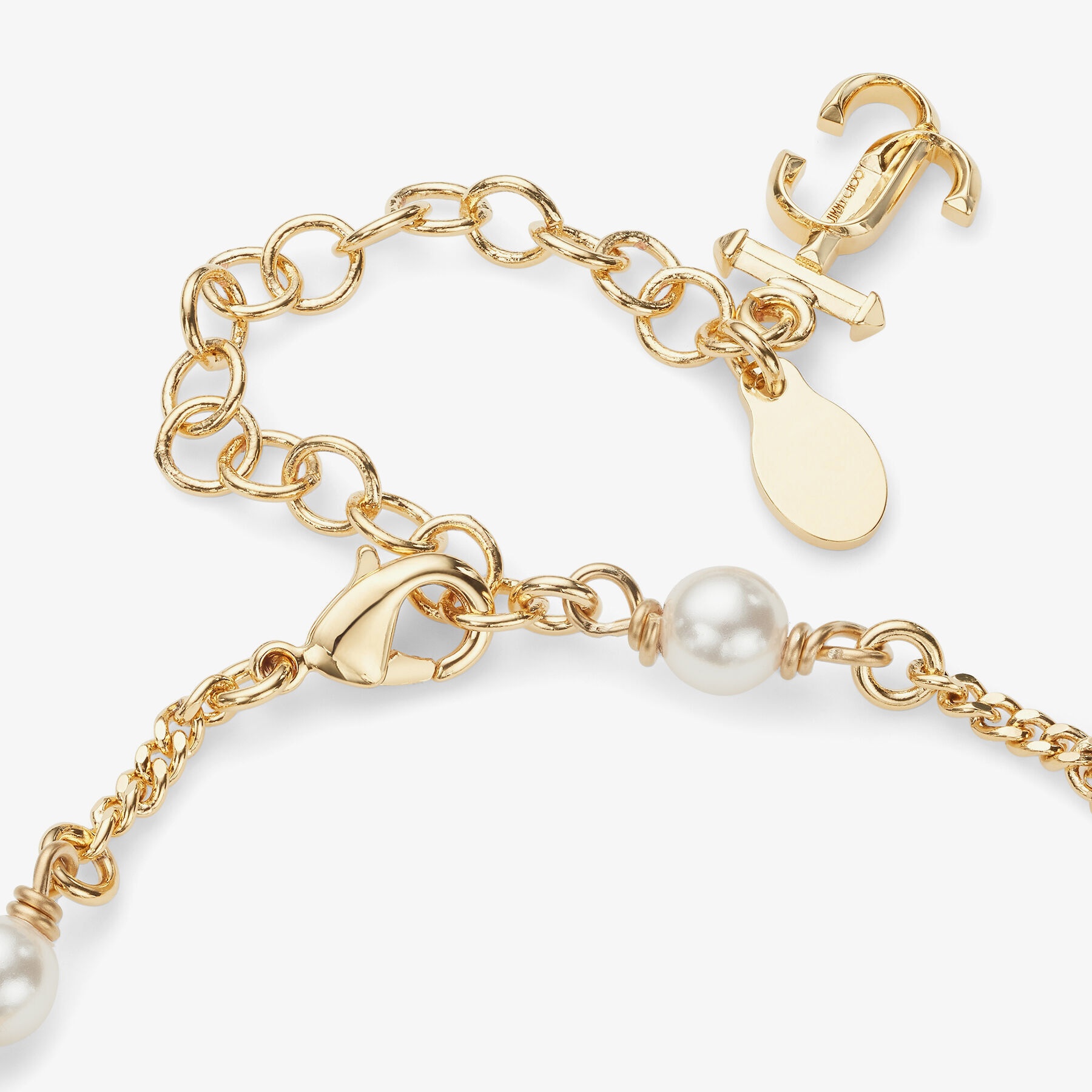JC Star Bracelet
Gold-Finish Metal Bracelet with Pearl, Star and JC Monogram Charms - 6