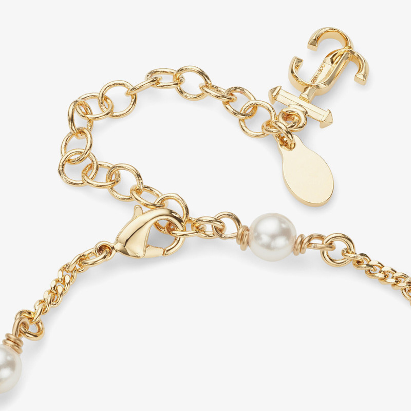 JC Star Bracelet
Gold-Finish Metal Bracelet with Pearl, Star and JC Monogram Charms 6