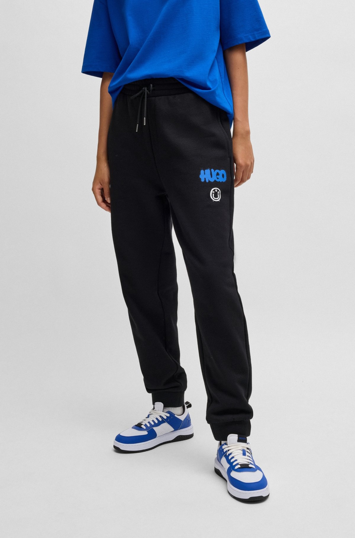 COTTON-TERRY TRACKSUIT BOTTOMS WITH HAPPY HUGO LOGO - 3