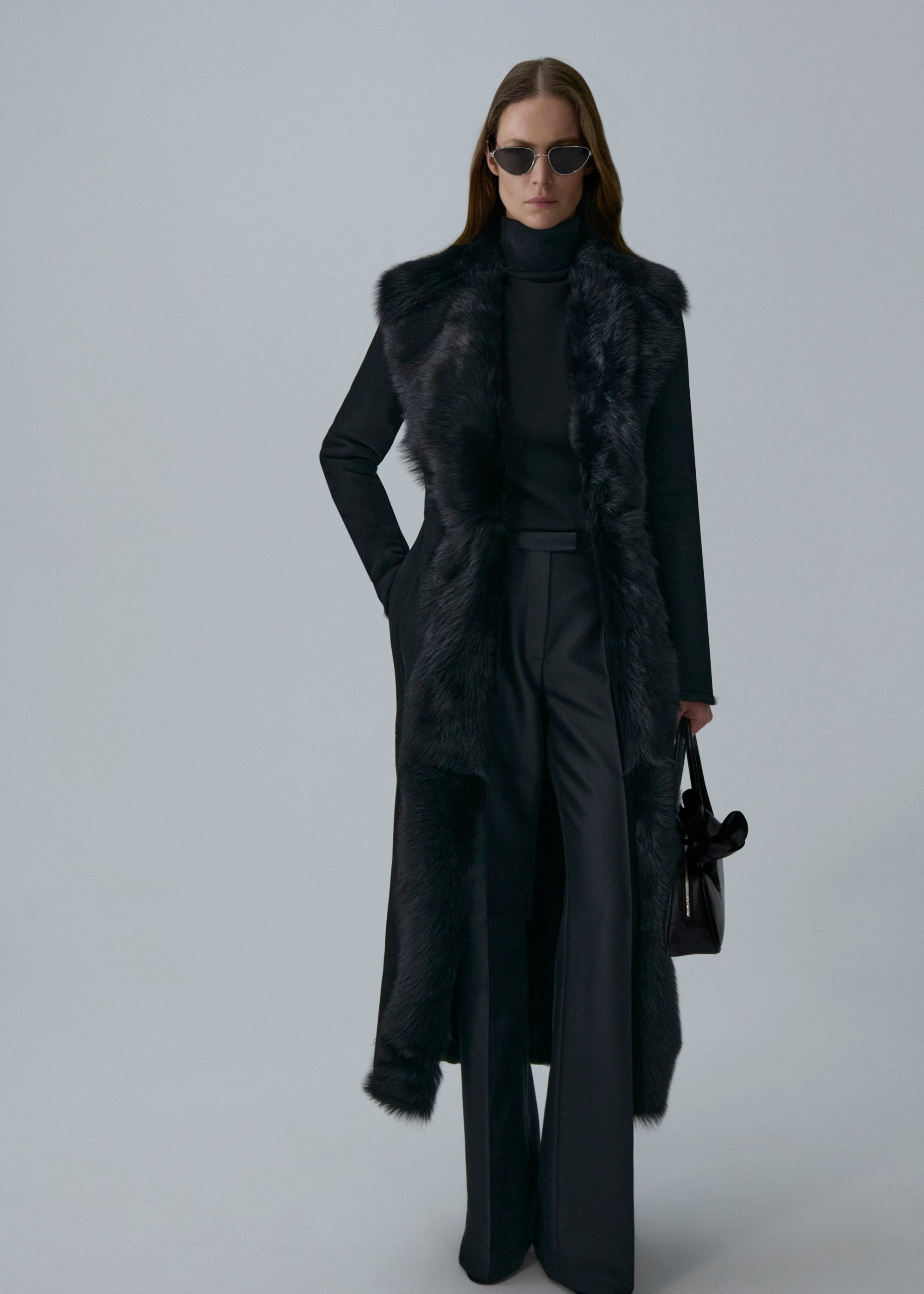 Longline shearling coat in black - 3