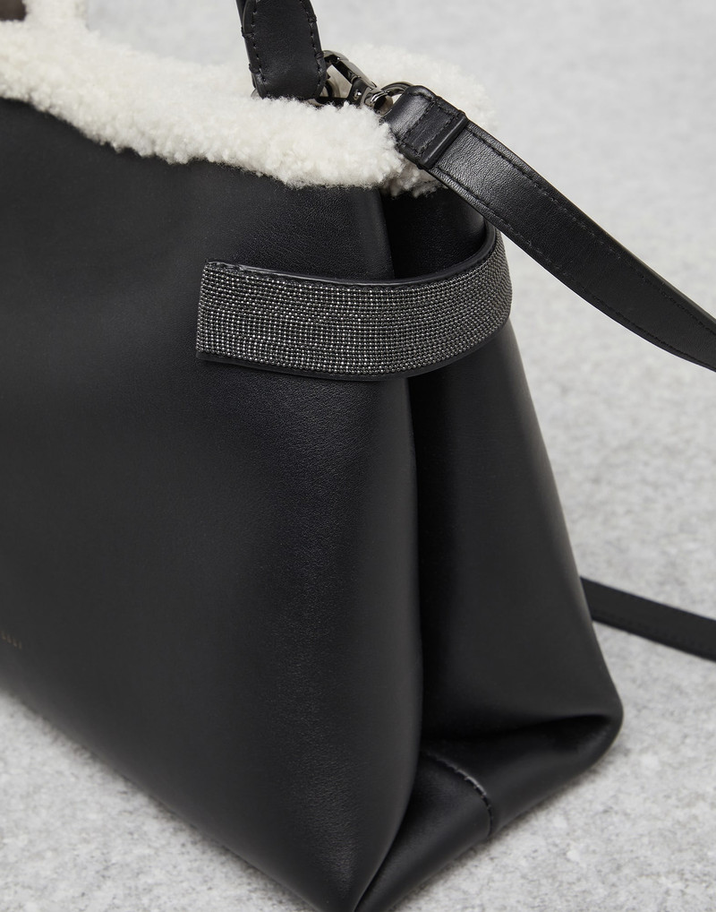 Matte calfskin bag with shearling trim and precious bands 3