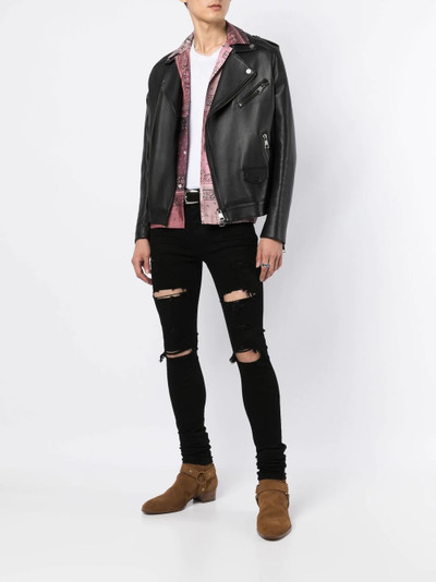 AMIRI distressed skinny jeans outlook