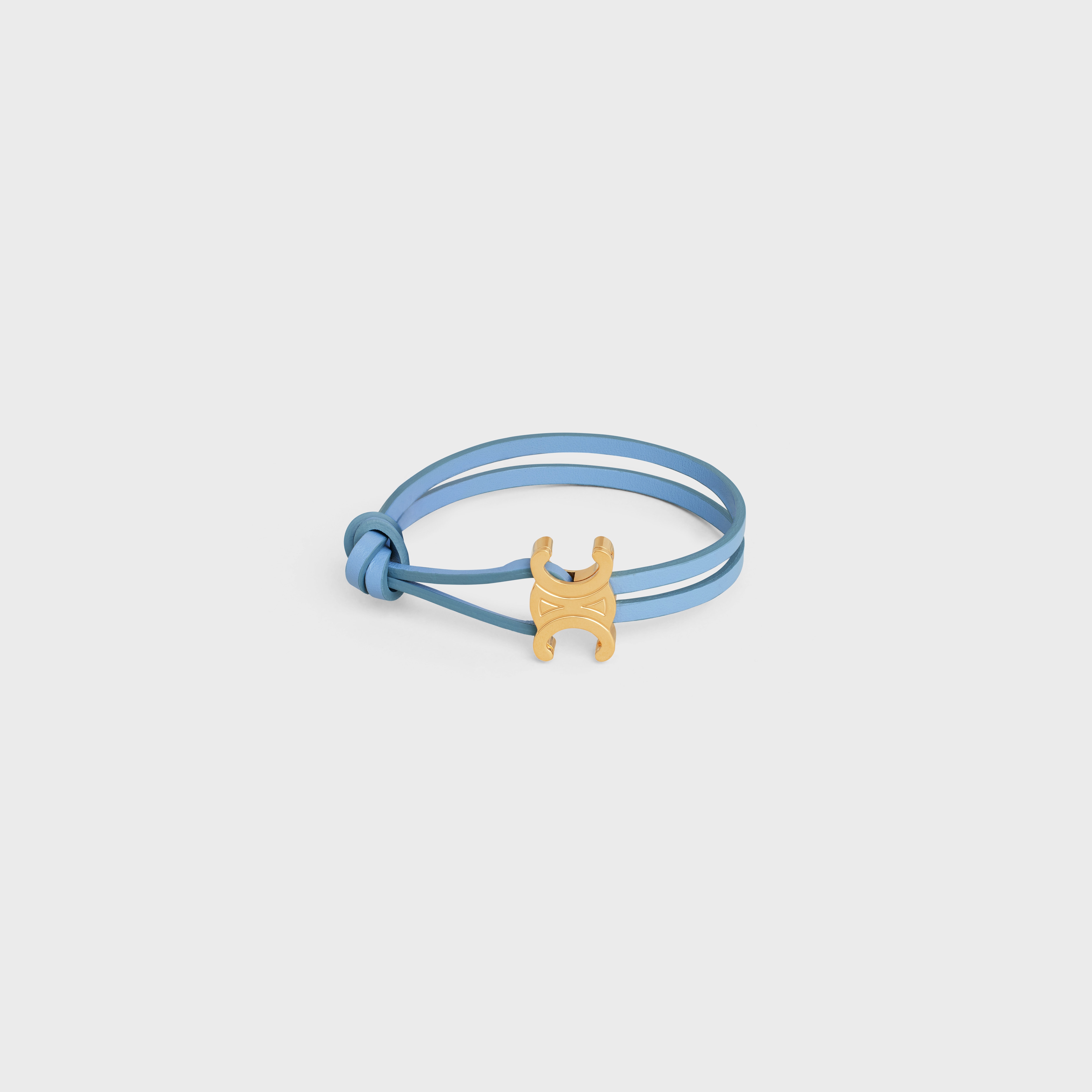Triomphe Clasp Bracelet in Brass with Gold Finish and Celeste Smooth Calfskin - 1