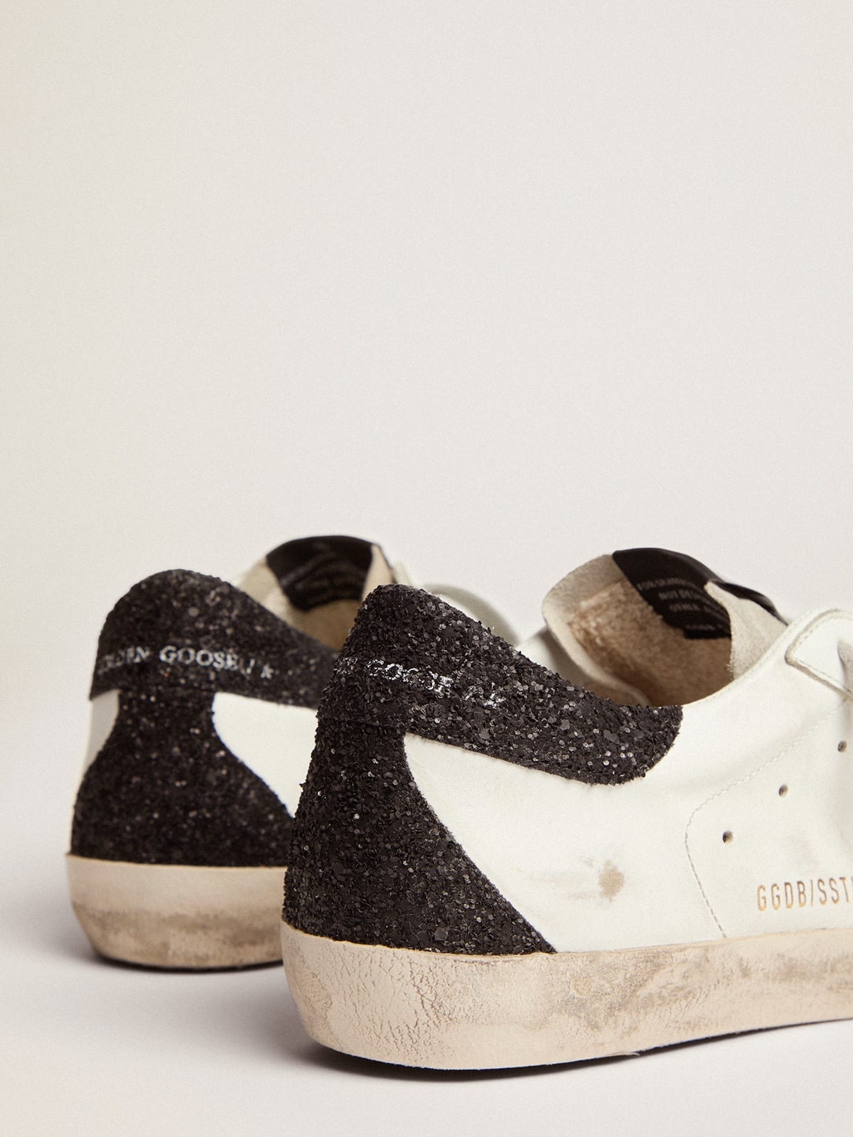 Golden Goose Super Star sneakers with gold star and glittery black heel tab REVERSIBLE