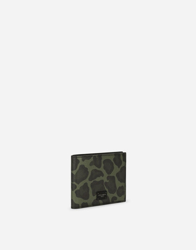 Dolce & Gabbana Dauphine calfskin bifold wallet with leopard print against a green background outlook