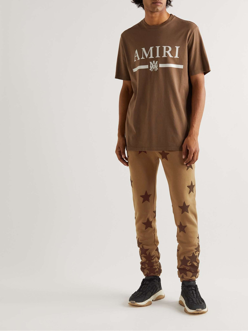 AMIRI + Chemist Tapered Suede-Appliquéd Cotton-Jersey Sweatpants outlook