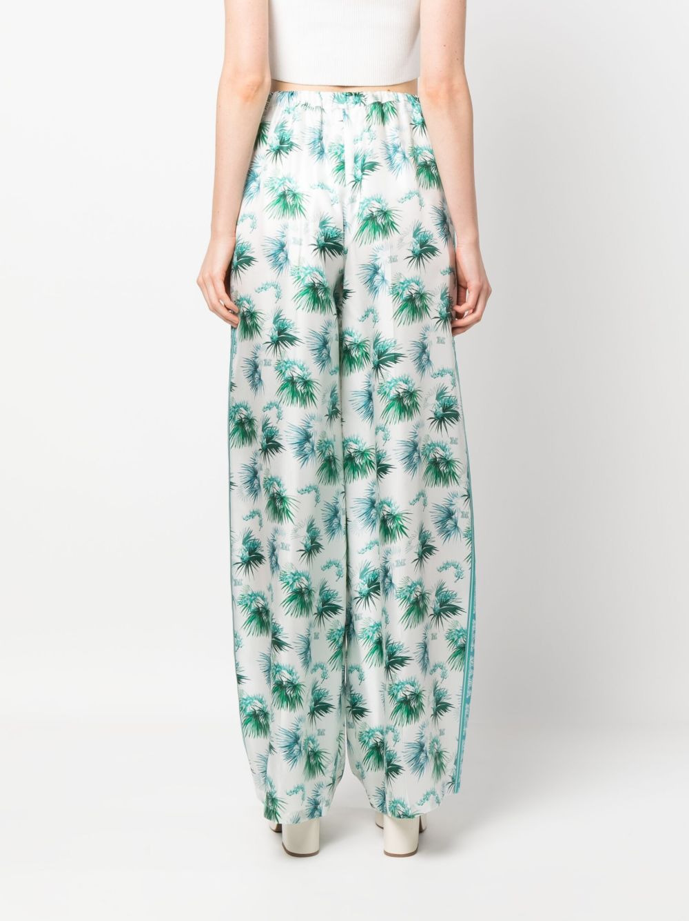 all-over graphic-print trousers - 4