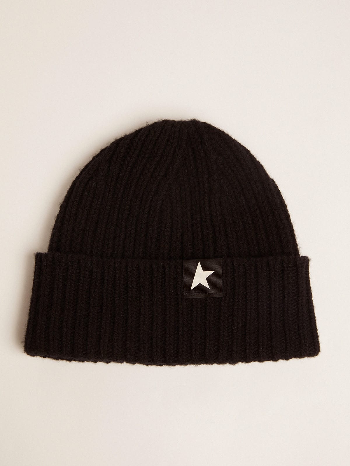 Black wool beanie with contrasting white star - 1