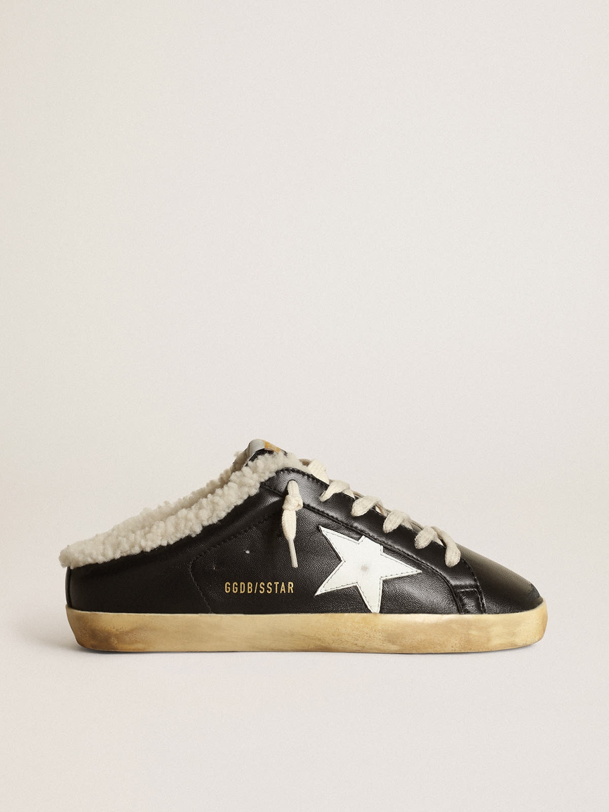Golden Goose Super-Star Sabots in black nappa leather with white leather  star and beige shearling lining | REVERSIBLE