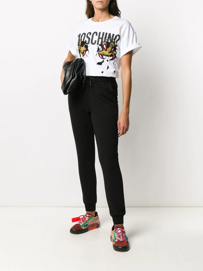 Moschino embroidered patch track pants outlook