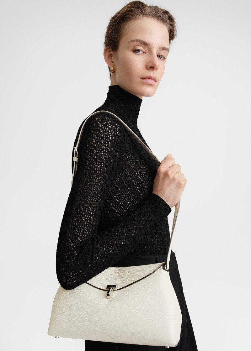 Totême T-Lock clutch milk grain outlook