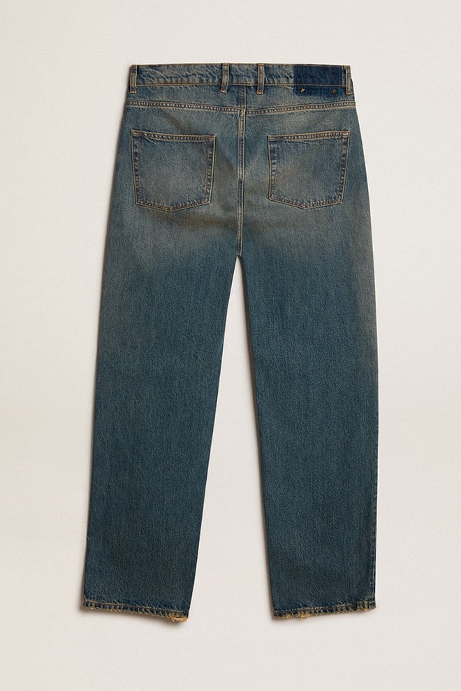 Blue jeans with a lived-in treatment - 5