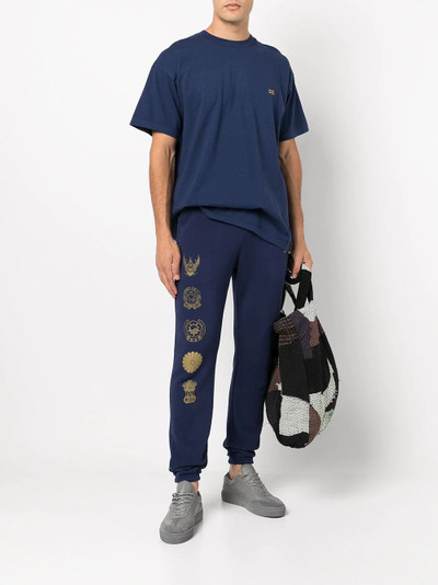 John Elliott Global Entry University Tee outlook