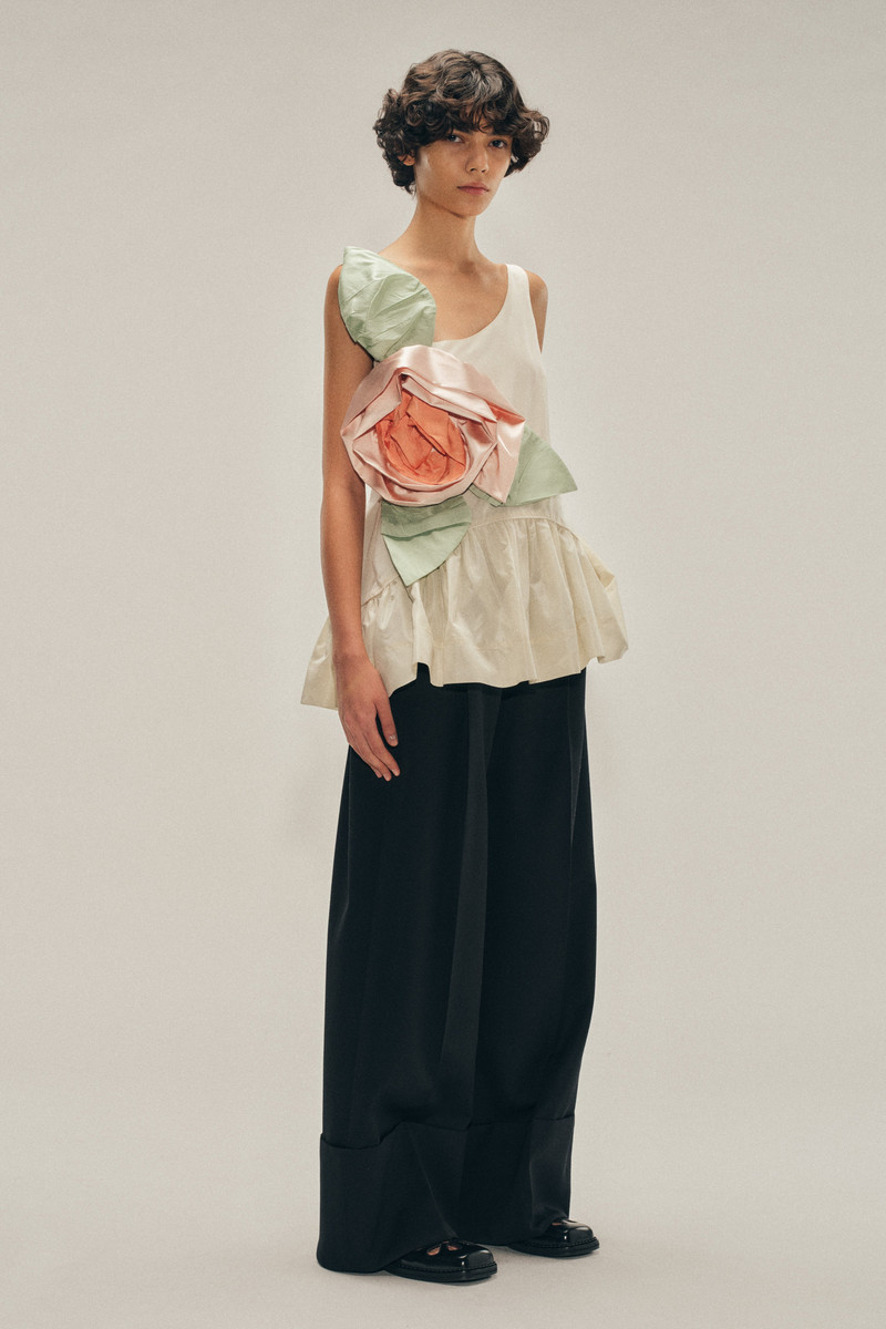 Pressed Rosette Tilted Neck Peplum Top 1