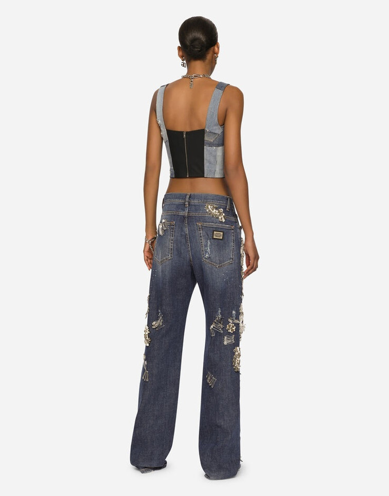 Denim jeans with ripped details and appliqués 3