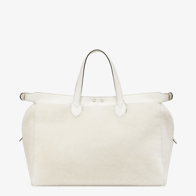 Peekaboo ISeeU Forty8 bag made of soft white sheepskin with an oversized shaved O’Lock motif. Roomy  4