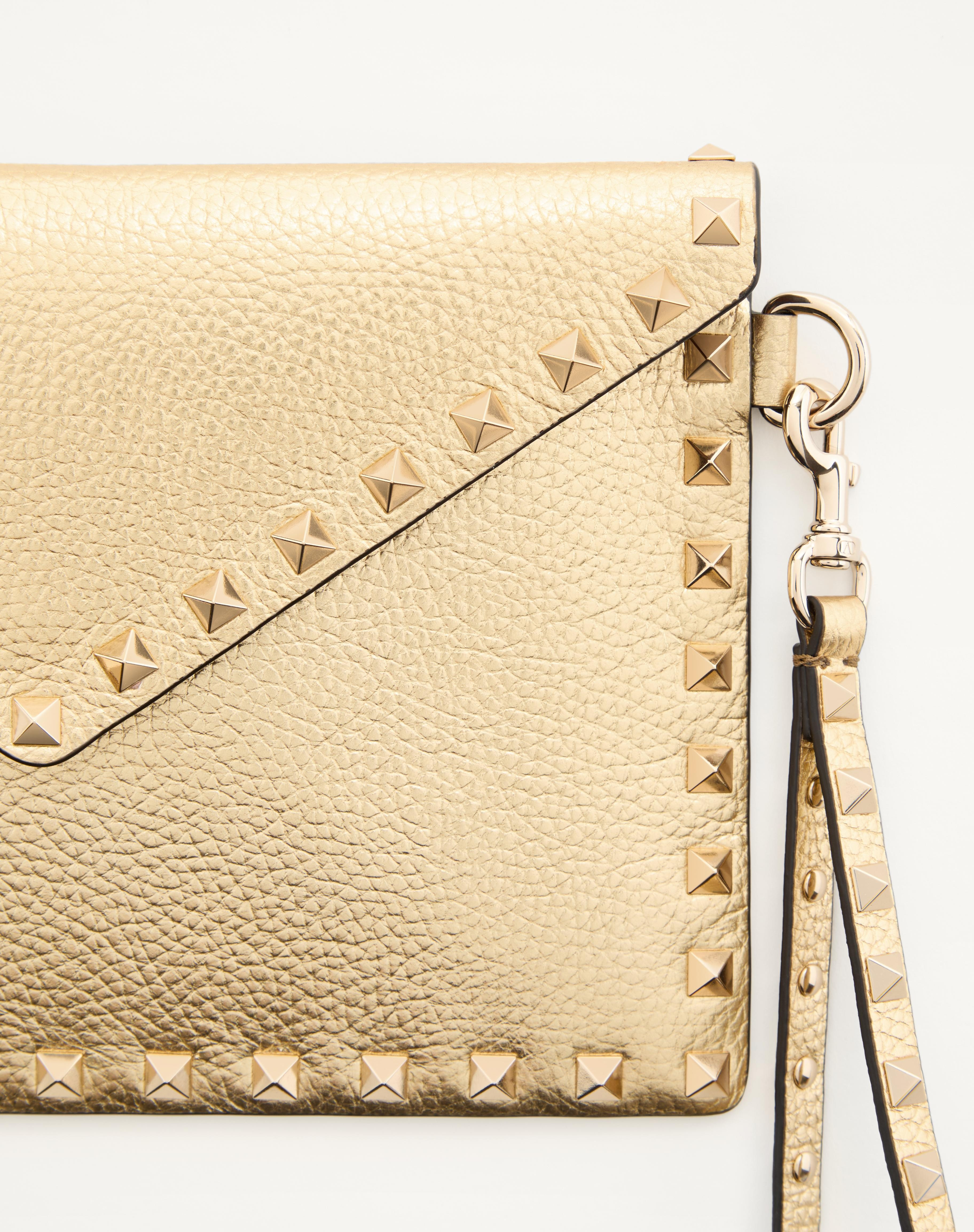 ROCKSTUD LAMINATED GRAINY CALFSKIN CLUTCH BAG - 7