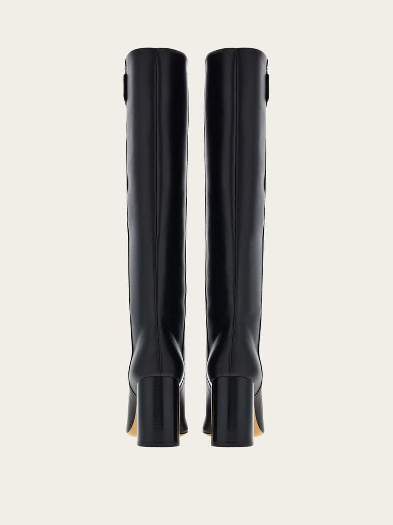 Knee high boot with golden tab 4