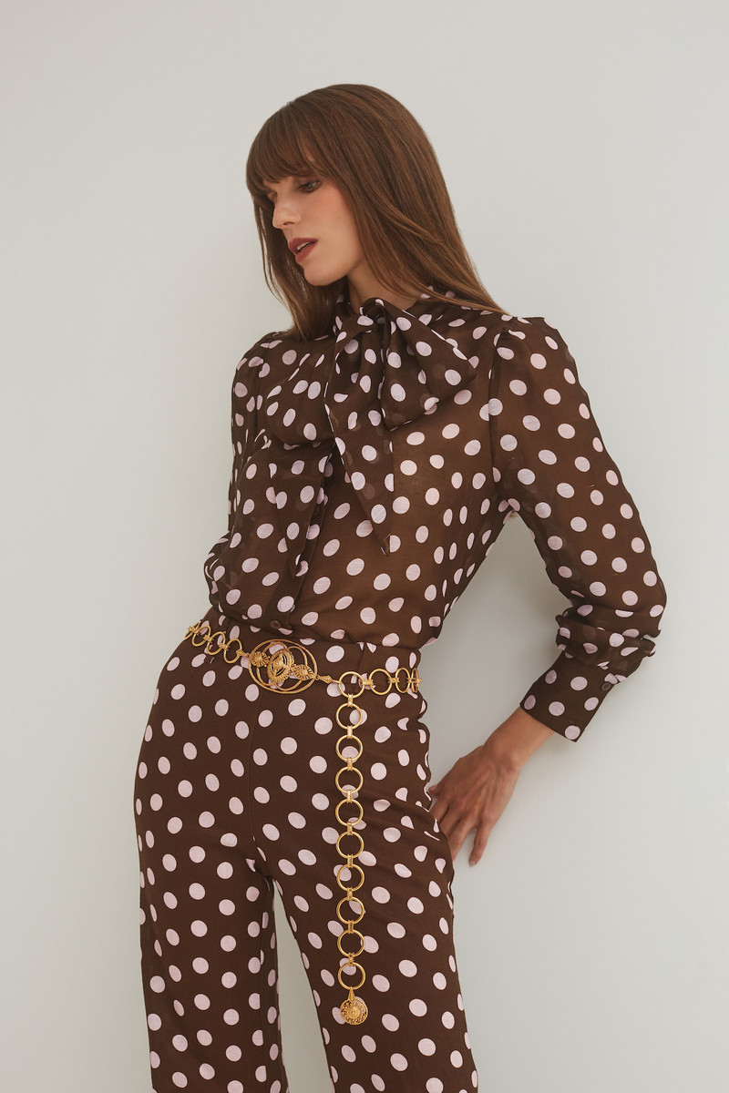Cara Cara Chili Shirt
Breezy Blouse with a Playful Bow and Timeless Dot Elegance outlook