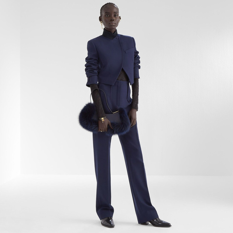 FENDI Pouch made of dark blue leather, embellished with tone on tone fox fur and decorated with Fendi Roma outlook
