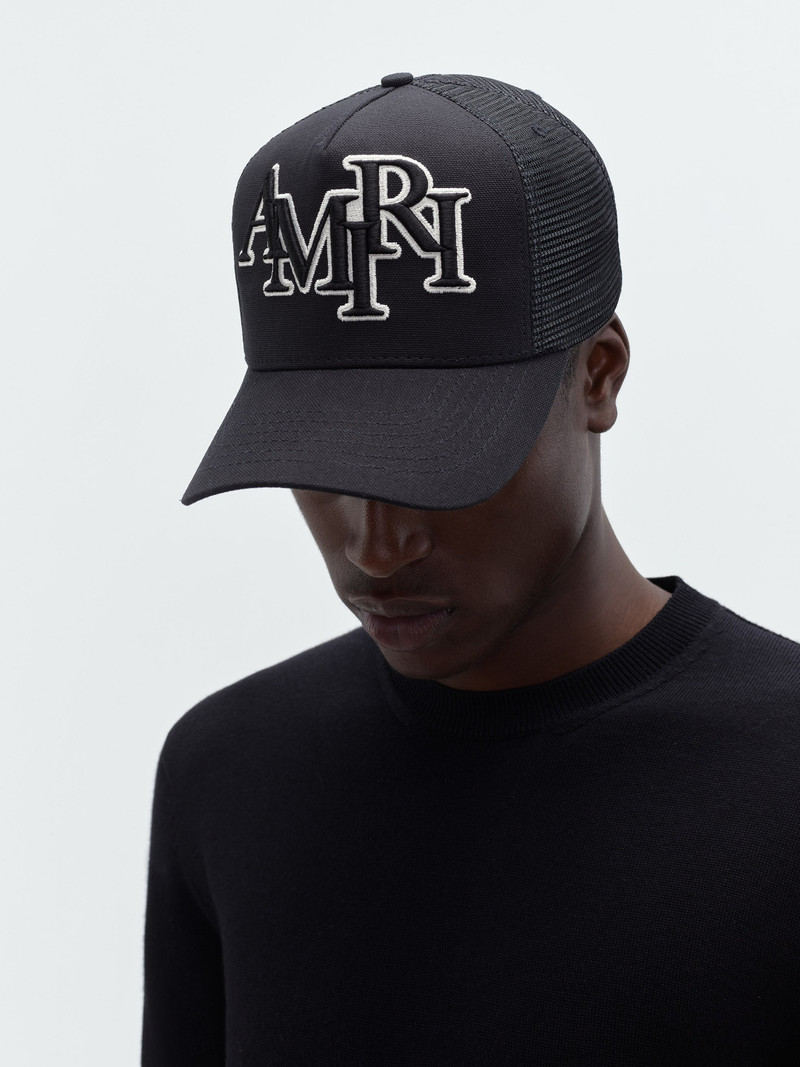 STAGGERED AMIRI LOGO TRUCKER 1