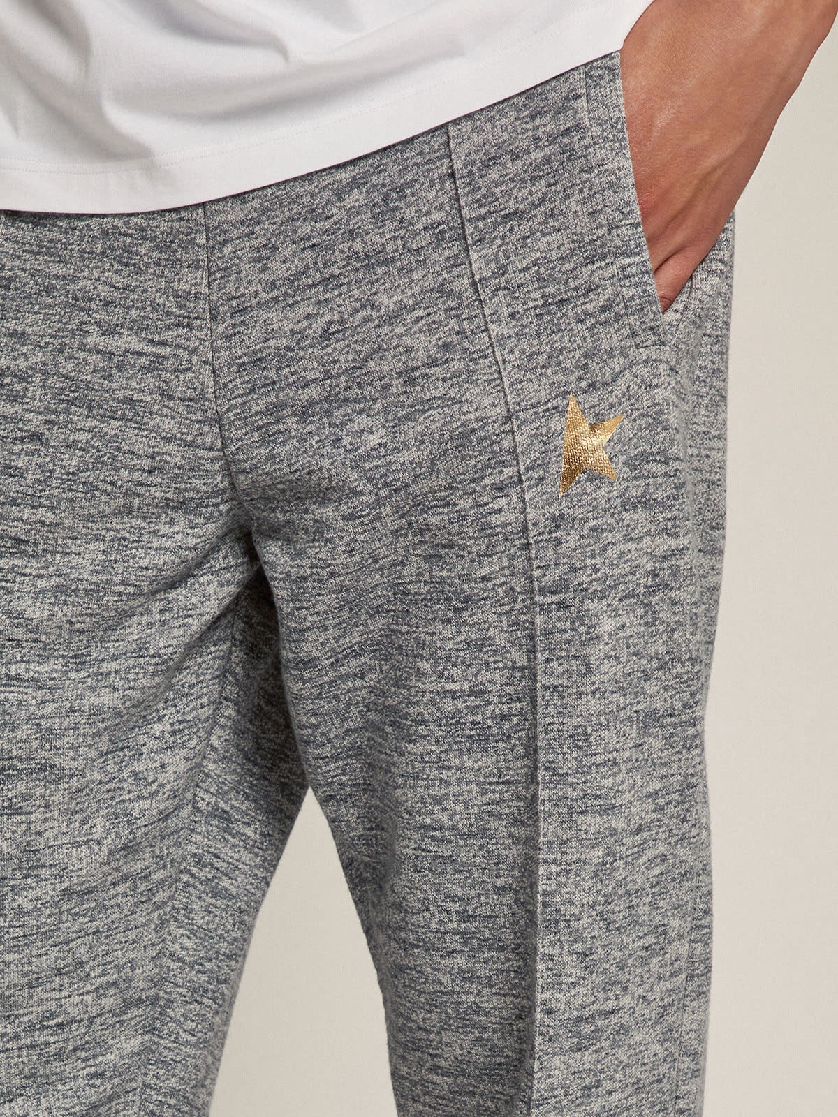 Men's gray joggers with gold star on the front