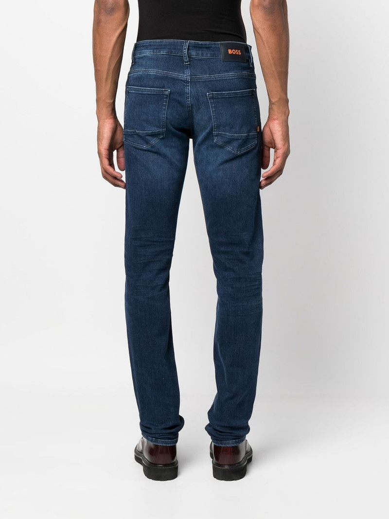 mid-wash logo-patch jeans 4