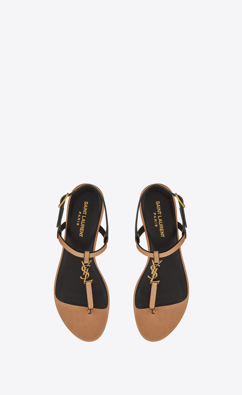 SAINT LAURENT cassandra flat sandals in vegetable-tanned leather with bronze-tone monogram outlook
