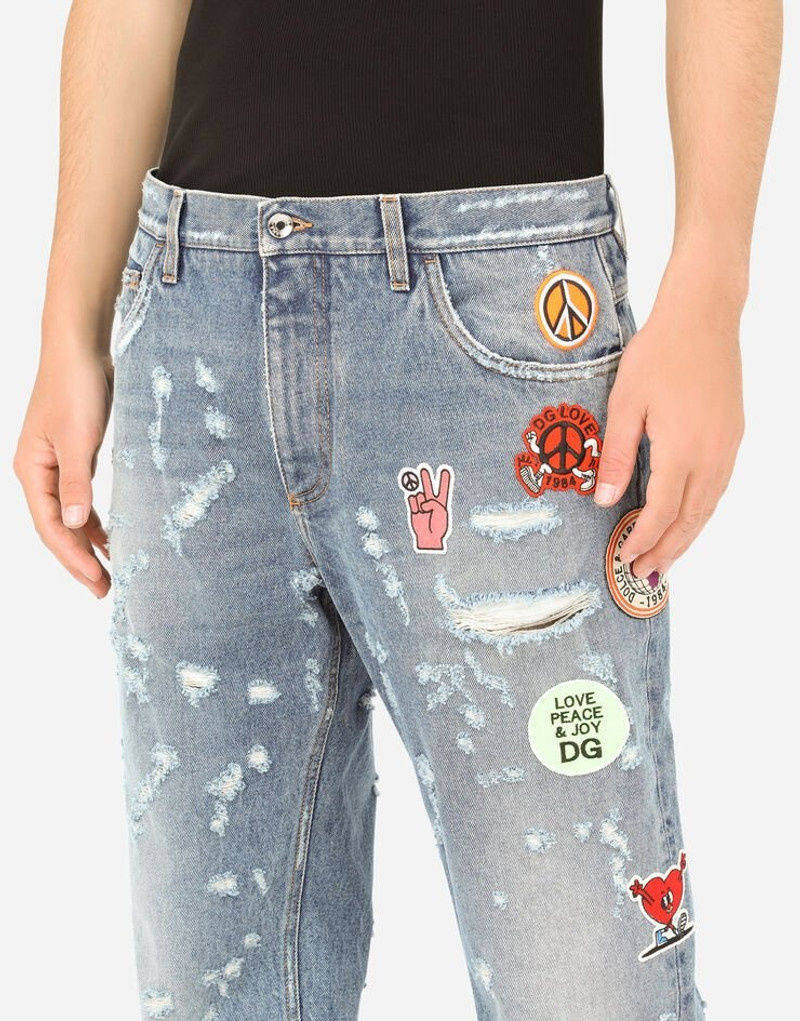 Loose light blue jeans with rips and patch detailing 4