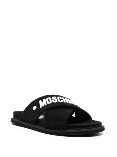 Moschino logo-embossed crossover-strap sandals outlook