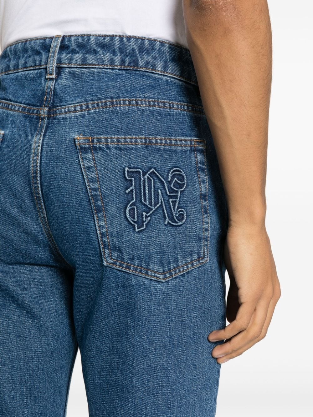 monogram-embossed straight-leg jeans - 5